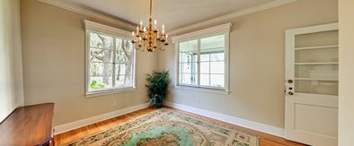 Wide panorama of unfurnished dining room with windows
